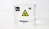 Clear acrylic cube displaying an Actinium element (Atomic Number 89) embedded within, offering a scientific presentation for collectors and science enthusiasts.