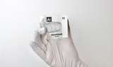 Clear acrylic cube displaying an Aluminum ampule with its atomic number 13. Perfect for educational settings, scientific collections, or as a unique decorative piece.