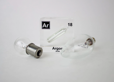 Clear acrylic cube displaying an Argon element (Atomic Number 18) embedded within, offering a scientific presentation for collectors and science enthusiasts.