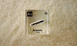 Arsenic element encased in a clear acrylic cube, showcasing its name, atomic number 33, and key properties from the periodic table. An informative and visually striking piece ideal for educational purposes and collectors.