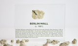 Clear acrylic display case featuring a historical fragment of the Berlin Wall, providing an authentic and educational presentation for history enthusiasts and collectors.