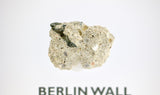 Clear acrylic display case featuring a historical fragment of the Berlin Wall, providing an authentic and educational presentation for history enthusiasts and collectors.