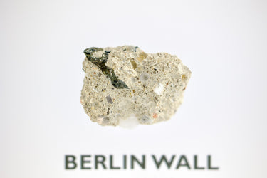 Clear acrylic display case featuring a historical fragment of the Berlin Wall, providing an authentic and educational presentation for history enthusiasts and collectors.