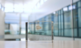 Clear acrylic display case featuring a historical fragment of the Berlin Wall, providing an authentic and educational presentation for history enthusiasts and collectors.