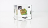 Clear acrylic cube displaying a Bismuth element (Atomic Number 83) embedded within, offering a scientific presentation for collectors and science enthusiasts.