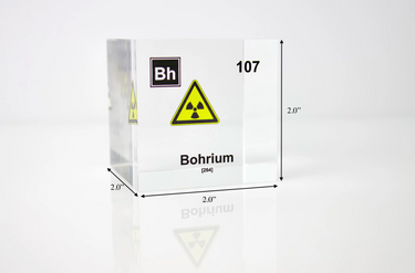 Clear acrylic cube displaying a Bohrium element (Atomic Number 107) embedded within, offering a scientific presentation for collectors and science enthusiasts. Radiation symbol.