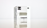 Clear acrylic cube displaying a Cadmium element (Atomic Number 48) embedded within, offering a scientific presentation for collectors and science enthusiasts.