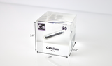 Clear acrylic cube displaying a Calcium element (Atomic Number 20) embedded within, offering a scientific presentation for collectors and science enthusiasts.