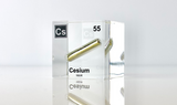 Clear acrylic cube displaying a Cesium element (Atomic Number 55) embedded within, offering a scientific presentation for collectors and science enthusiasts.