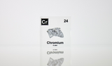 Chromium enclosed in a clear acrylic cube, highlighting its name, atomic number 24, and key properties from the periodic table. A great educational tool and collector’s piece.