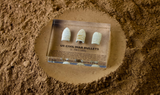 Clear acrylic display case featuring historical Civil War bullets, offering an educational presentation for collectors and enthusiasts of American history.