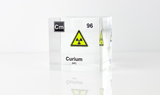 Clear acrylic cube displaying a Curium element (Atomic Number 96) embedded within, offering a scientific presentation for collectors and science enthusiasts.