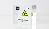 Clear acrylic cube displaying a Darmstadtium element (Atomic Number 110) embedded within, offering a scientific presentation for collectors and science enthusiasts.
