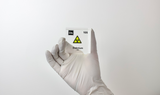 Clear acrylic cube displaying a Dubnium element (Atomic Number 105) embedded within, offering a scientific presentation for collectors and science enthusiasts.