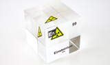 Clear acrylic cube displaying an Einsteinium element (Atomic Number 99) embedded within, offering a scientific presentation for collectors and science enthusiasts.