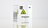 Clear acrylic cube displaying an Einsteinium element (Atomic Number 99) embedded within, offering a scientific presentation for collectors and science enthusiasts.