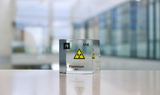 Clear acrylic cube displaying a Flerovium element (Atomic Number 114) embedded within, offering a scientific presentation for collectors and science enthusiasts.