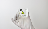 Clear acrylic cube displaying a Flerovium element (Atomic Number 114) embedded within, offering a scientific presentation for collectors and science enthusiasts.