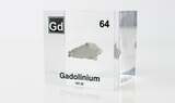 Clear acrylic cube displaying a Gadolinium element (Atomic Number 64) embedded within, offering a scientific presentation for collectors and science enthusiasts.