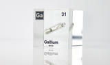 Gallium element encased in a clear acrylic cube, featuring its name, atomic number 31, and properties as displayed on the periodic table. Ideal for educational and collector use.