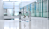 Clear acrylic cube displaying a Hafnium element (Atomic Number 72) embedded within, offering a scientific presentation for collectors and science enthusiasts.