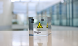 Clear acrylic cube displaying a Hassium element (Atomic Number 108) embedded within, offering a scientific presentation for collectors and science enthusiasts.