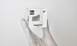 Clear acrylic cube displaying a Holmium element (Atomic Number 67) embedded within, offering a scientific presentation for collectors and science enthusiasts.