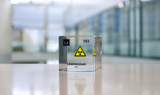 Clear acrylic cube displaying a Lawrencium element (Atomic Number 103) embedded within, offering a scientific presentation for collectors and science enthusiasts.