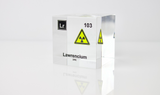 Clear acrylic cube displaying a Lawrencium element (Atomic Number 103) embedded within, offering a scientific presentation for collectors and science enthusiasts.