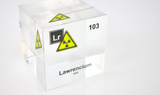 Clear acrylic cube displaying a Lawrencium element (Atomic Number 103) embedded within, offering a scientific presentation for collectors and science enthusiasts.