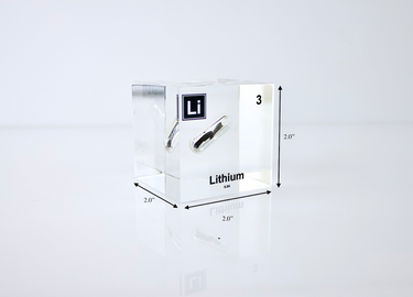 Clear acrylic cube displaying a Lithium element (Atomic Number 3) embedded within, offering a scientific presentation for collectors and science enthusiasts.