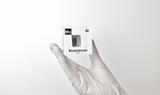 Clear acrylic cube displaying a Molybdenum element (Atomic Number 42) embedded within, offering a scientific presentation for collectors and science enthusiasts.