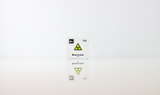 Clear acrylic cube displaying a Moscovium element (Atomic Number 115) embedded within, offering a scientific presentation for collectors and science enthusiasts.