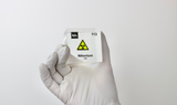 Clear acrylic cube displaying a Nihonium element (Atomic Number 113) embedded within, offering a scientific presentation for collectors and science enthusiasts.