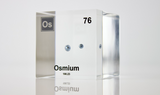 Piece of Osmium encased in a clear acrylic cube, with the element's name, atomic number, and properties displayed as on the periodic table for a sleek, educational display.