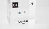 Piece of Osmium encased in a clear acrylic cube, with the element's name, atomic number, and properties displayed as on the periodic table for a sleek, educational display.