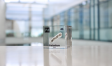 Clear acrylic cube displaying a Palladium element (Atomic Number 46) embedded within, offering a scientific presentation for collectors and science enthusiasts.