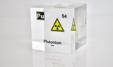 Clear acrylic cube displaying a Plutonium element (Atomic Number 94) embedded within, offering a scientific presentation for collectors and science enthusiasts.