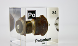 Clear acrylic cube displaying a Polonium element (Atomic Number 84) embedded within, offering a scientific presentation for collectors and science enthusiasts.