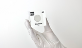 Clear acrylic cube displaying a Rhodium element (Atomic Number 45) embedded within, offering a scientific presentation for collectors and science enthusiasts.