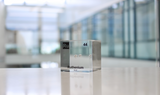 Clear acrylic cube displaying a Ruthenium element (Atomic Number 44) embedded within, offering a scientific presentation for collectors and science enthusiasts.