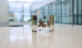 Iron element encased in a clear acrylic cube, featuring its name, atomic number, and key properties from the periodic table. A striking and educational display for science enthusiasts and collectors
