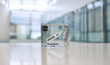 Clear acrylic cube displaying a Scandium element (Atomic Number 21) embedded within, offering a scientific presentation for collectors and science enthusiasts.