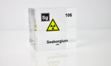 Clear acrylic cube displaying a Seaborgium element (Atomic Number 106) embedded within, offering a scientific presentation for collectors and science enthusiasts.