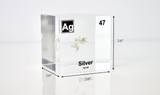 Clear acrylic cube displaying a Silver element (Atomic Number 47) embedded within, offering a scientific presentation for collectors and science enthusiasts.