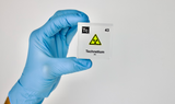 Clear acrylic cube displaying a Technetium element (Atomic Number 43) embedded within, offering a scientific presentation for collectors and science enthusiasts.