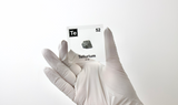 Clear acrylic cube displaying a Tellurium element (Atomic Number 52) embedded within, offering a scientific presentation for collectors and science enthusiasts.