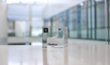 Clear acrylic cube displaying a Thallium element (Atomic Number 81) embedded within, offering a scientific presentation for collectors and science enthusiasts.