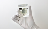 Clear acrylic cube displaying a Tin element (Atomic Number 50) embedded within, offering a scientific presentation for collectors and science enthusiasts.