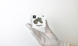 Clear acrylic cube displaying a Titanium element (Atomic Number 22) embedded within, offering a scientific presentation for collectors and science enthusiasts.